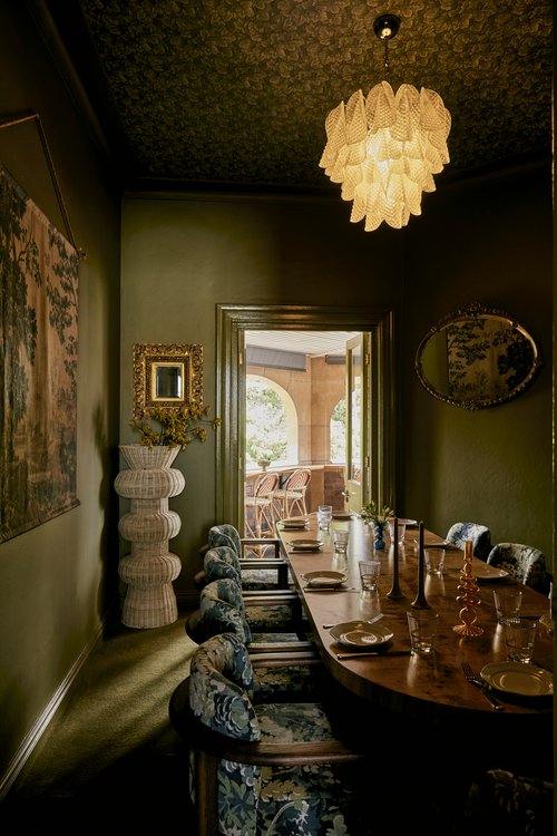 Golden and green tapestry hanging on wall in private dinging space at a newly completed Sydney Italian restaurant