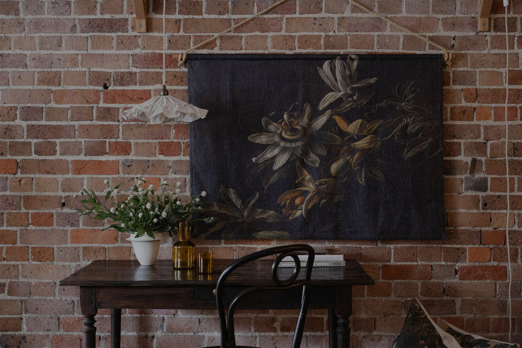 Vintage style floral moody dark linen oil painting wall hanging with antique desk and thonet bentwood chair